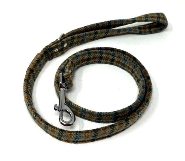 Dog leash with patterned design and metal clip on a white background