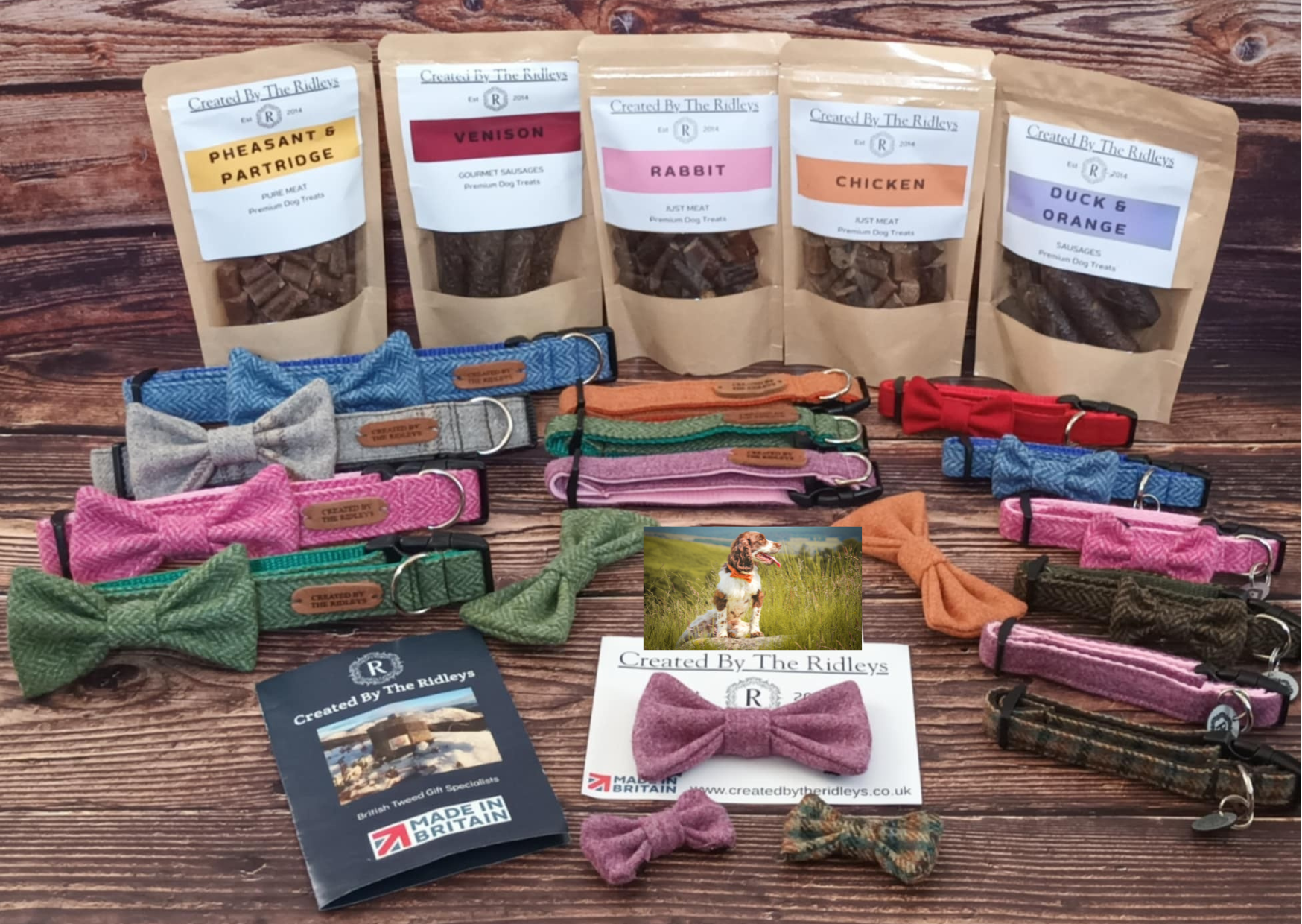 Collection of dog products including bags of treats, tweed collars created by the ridleys, and bow ties on a wooden surface.