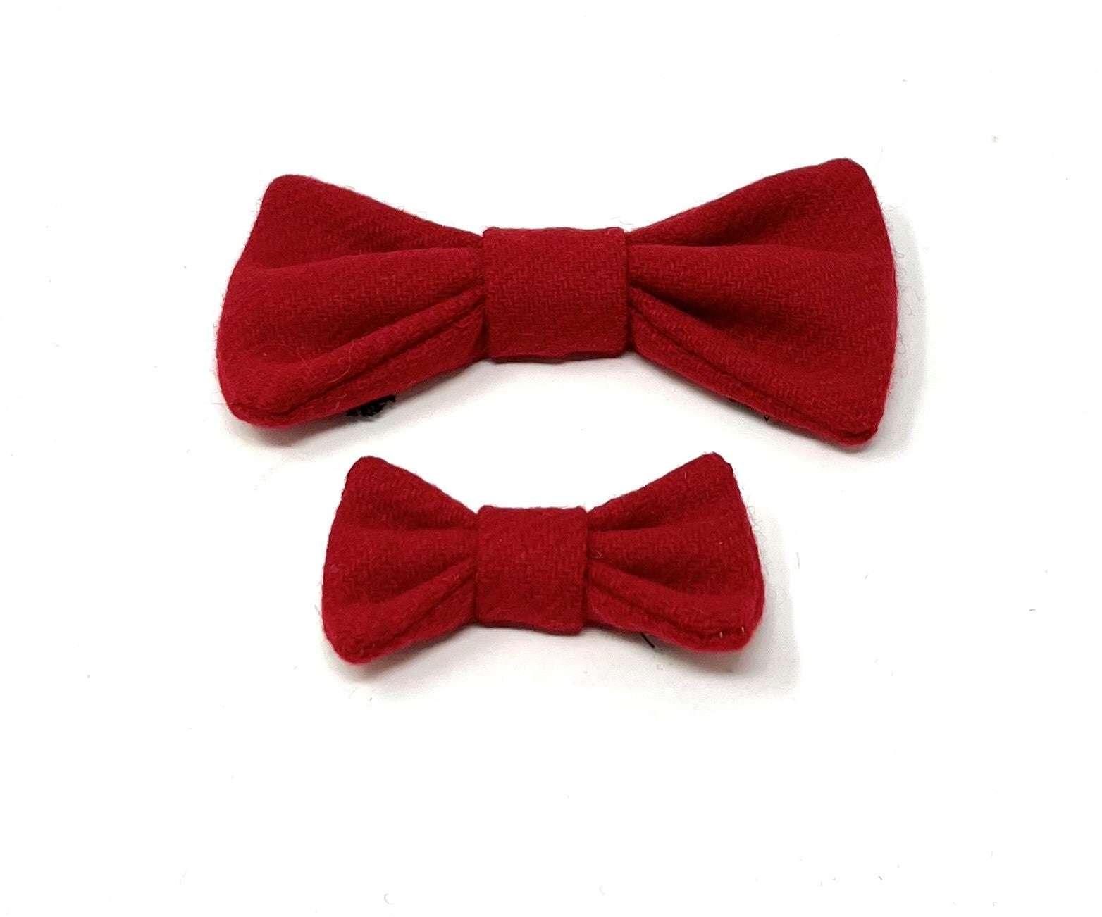 2 red tweed dog bow ties on a white background