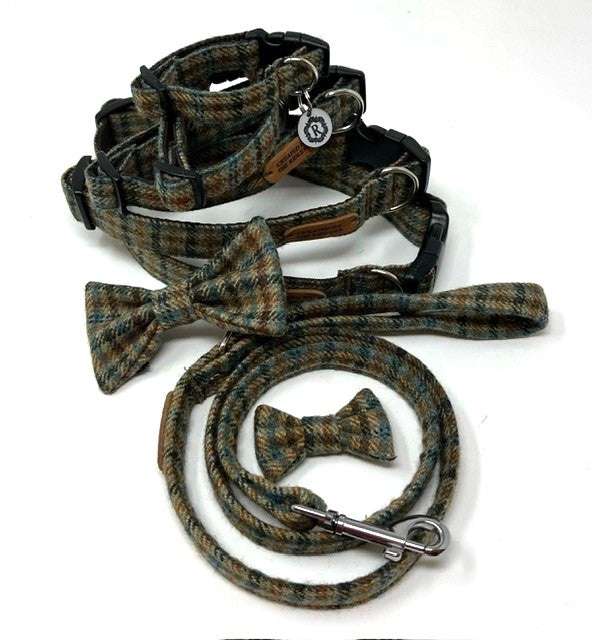 Plaid dog collar, leash, and bow tie set on a white background
