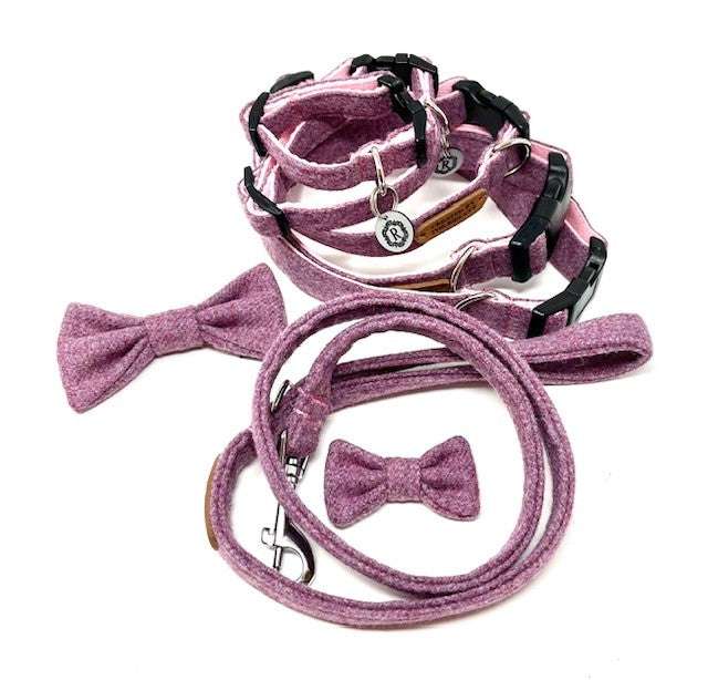 A set of British tweed dog collar, lead, and bow tie in various shades of blue and patterns, displayed on a white background.